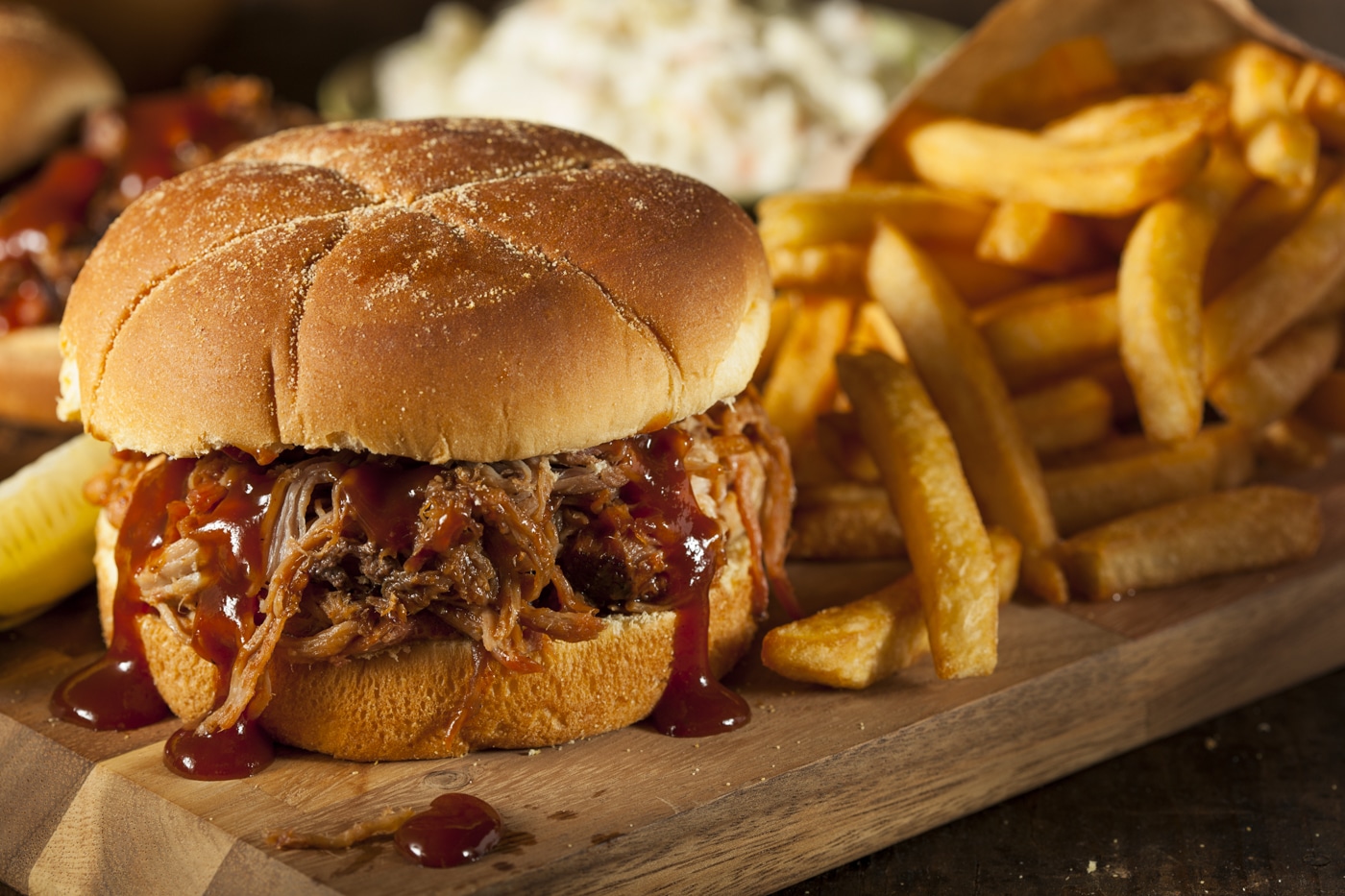 Pulled pork sandwich with barbecue sauce and fries from Jack's BBQ